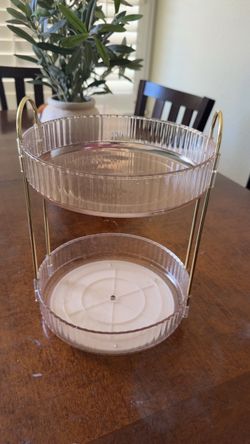 Rotating acrylic perfume/makeup stand