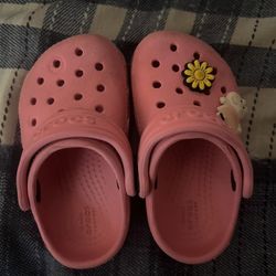 Bundle Of Crocs And A Toy 