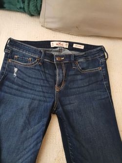 Hollister low rise skinny. W29L33. Size 9L jeans. Dark washed distressed blue denim with some snags for looks.