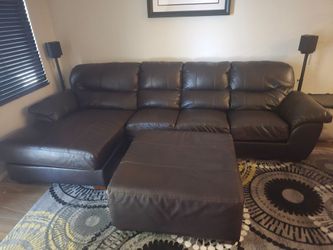 Dark brown leatherette sectional couch  with ottoman