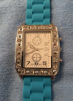 Silver tone with diamond accents watch with blue rubber band