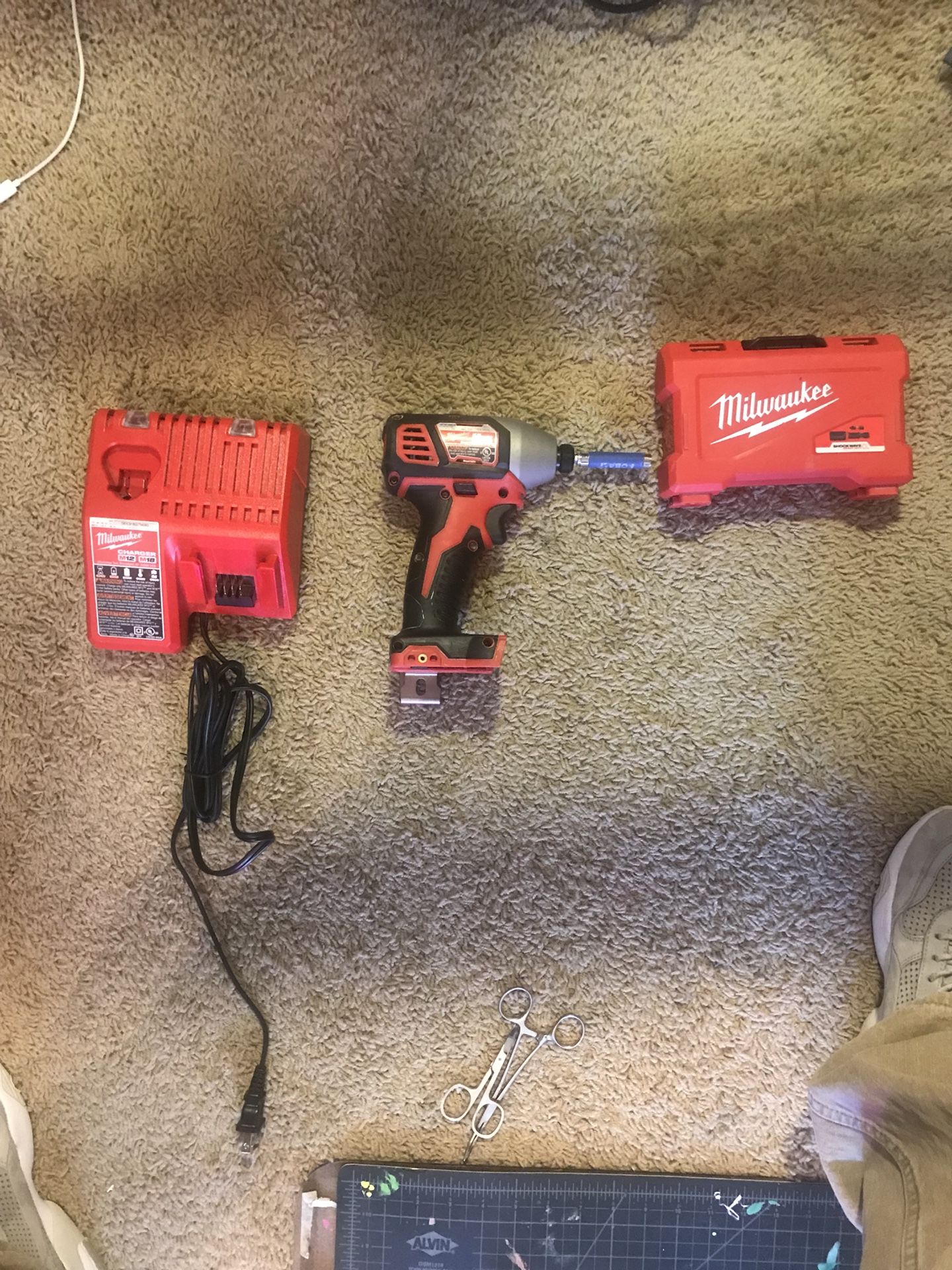 Milwaukee Impact and charger, comes with 18v battery too just not in pic! 150$