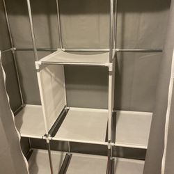 Closet Organizer, Has Poles For Hanging 