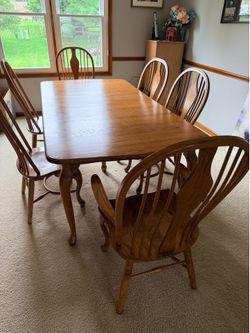 Solid oak dining table with chairs