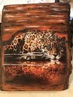 Transfer print of leopard onto a wooden park board