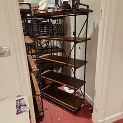 Six foot tall four foot wide rustic wood and pipe shells