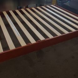 Rustic solid wood bed frame with reliable slat support, easy setup.