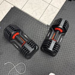 Adjustable dumbells - (new)