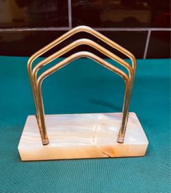 Beautiful natural onyx and brass letter/cutting board holder.