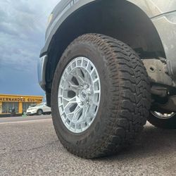 18x9 XM Wheels And Tires 275/65/18 AT