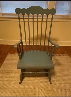 Wooden rocking chair. Needs to be refinished.