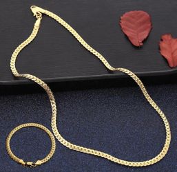 New 18 k yellow gold Cuban link chain and bracelet