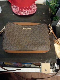 Tan colored Michael Kors small satchel bag