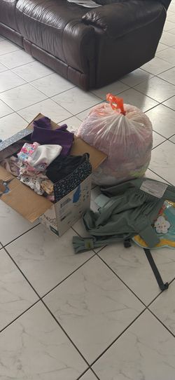 Box of Girl baby and toddler clothes/ boba baby carrier
