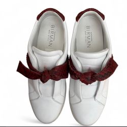 Alexandre Birman Clarita Jungle sneakers featuring a white leather body, a signature red python-effect bow, and a flat rubber sole Size 38