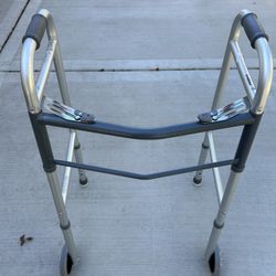 Folding walker with wheels