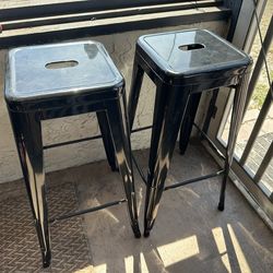 Two metal black barstools
