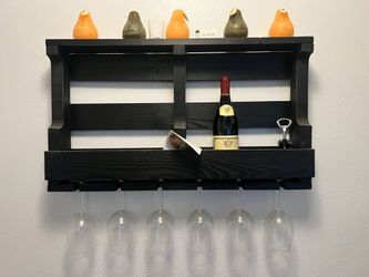 Black wall-mounted wine and stemware shelf