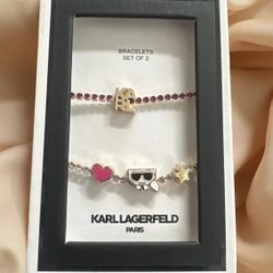 Karl Lagerfeld Paris gold-tone And Pink  2-piece set of crystal slider charm bracelets. 