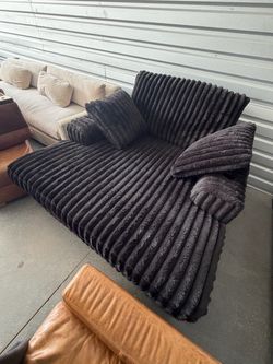 Black corduroy couch with cup holders