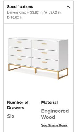 White dresser with gold metal