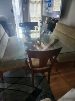 Dinning room set 2 benched 2 chairs and windows treatment to match the chairs.