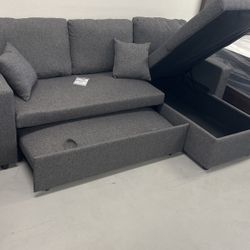 Brand New sectional sofa with chaise storage and pull out bed!