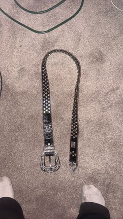 black studded western rhinestone belt with a silver crystal buckle