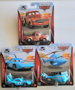 Disney Pixar Cars characters: Hot Rod Smokey pickup truck, Strip Weathers 'The King' race car, and Rotor Turbosky helicopter. Each item is a 1:55 scal