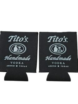 Set of two white on black original Tito's drink cozies. NWOT.