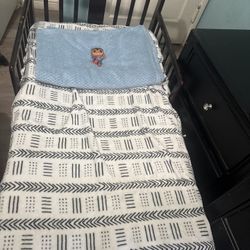 Dark Wood Toddler Bed mattress and blankets 