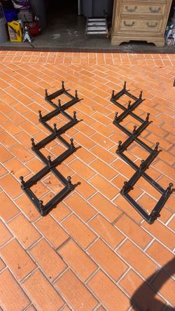 2  adjustable wall rack hangers.