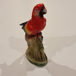 Vintage ceramic parrot figurine multicolor red yellow 8.25" tall.  
Pre-owned, good shape, no chips or cracks. 