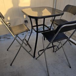 IKEA OUTDOOR PATIO DINING FURNITURE WITH FOLDING CHAIRS. 