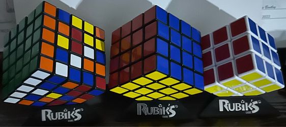 Lot of 3 Official Rubik's Cubes with Display Stands - 3x3, 4x4, 5x5 special and professional not like the other on market .
