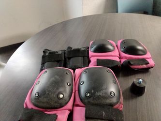 Vintage roller derby skates with protection equipment