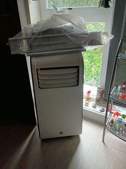 Kenmore air conditioner with attachments  8000 btu