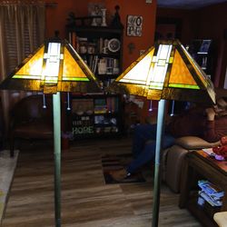 Two Amazon Tiffany pole lamps. Brown/brass
