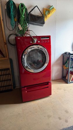 Electric dryer with storage drawer