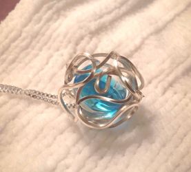 Sterling Silver Wire Wrapped globe with teal Crystal Necklace; Jewelry
