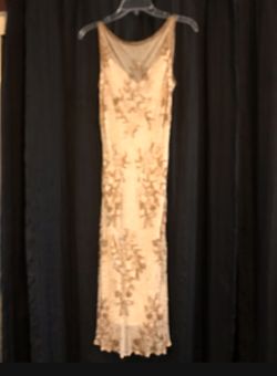 Gorgeous cream color dress, beaded throughout. Scoop back. Used for daughter of bride dress.