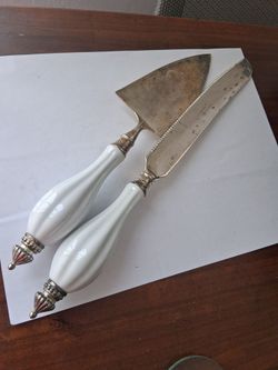 vintage Godinger Silver Art Co. cake knife and server set featuring white porcelain handles.