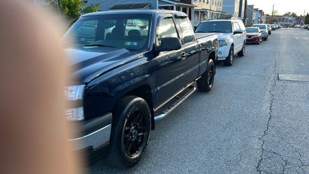 Black rims for sale six month old with used tire
