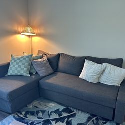 slightly worn blue couch