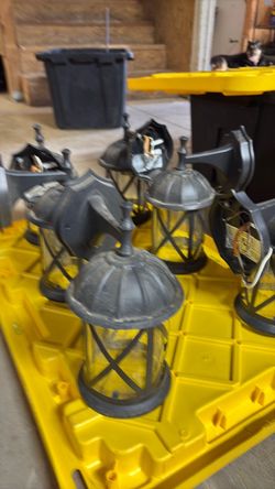 Six Wall mount lights and two lamp post, fixtures, needs inside parts
