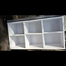 Shoe storage bench with cushion to sit on top