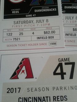 Two tickets and parking . Saturday vs Reds