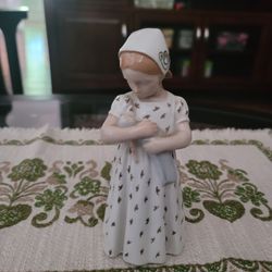 PBing and Grondahl Copenhagen - B&G - #1721 Mary Girl With Doll. Measures 7.5” tall.