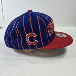 Chicago Cubs New Era 9FIFTY Snapback Cap with blue and orange vertical stripes