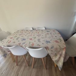 White table with 6 white chairs